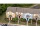 Aerial view of townhomes with well-maintained lawns, landscaping, and ample parking at 1250 Charlesworth Dr, Wesley Chapel, FL 33543