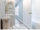 This bathroom features a toilet and single sink vanity and mirror with a view to hallway at 1250 Charlesworth Dr, Wesley Chapel, FL 33543