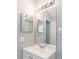 This is a close-up of a bathroom vanity with a mirror and lighting at 1250 Charlesworth Dr, Wesley Chapel, FL 33543