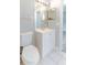 This bathroom has a toilet and a single sink vanity with an overhead light at 1250 Charlesworth Dr, Wesley Chapel, FL 33543