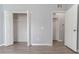 Spacious closet with view of light and airy bedroom with gray walls at 1250 Charlesworth Dr, Wesley Chapel, FL 33543