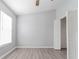 Bright bedroom with wood-look floors, window, and closet at 1250 Charlesworth Dr, Wesley Chapel, FL 33543