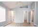 This bedroom has a ceiling fan, window, and adjoining bathroom and closet at 1250 Charlesworth Dr, Wesley Chapel, FL 33543
