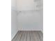 This is a walk-in closet with wire shelving and wood-style laminate flooring at 1250 Charlesworth Dr, Wesley Chapel, FL 33543