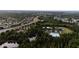 Aerial view of the community with a tennis court, beach volleyball, playground, basketball court, clubhouse and pool at 1250 Charlesworth Dr, Wesley Chapel, FL 33543