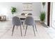 Dining area with modern table set and a sliding glass door leading to backyard at 1250 Charlesworth Dr, Wesley Chapel, FL 33543