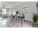 Cozy dining area featuring a stylish table and chairs, with a view of the living room at 1250 Charlesworth Dr, Wesley Chapel, FL 33543