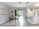 Dining area with table and chairs, with view of kitchen at 1250 Charlesworth Dr, Wesley Chapel, FL 33543