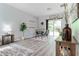 Dining area with modern table set, sliding glass doors, and natural light at 1250 Charlesworth Dr, Wesley Chapel, FL 33543