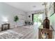 Dining area with modern table set, sliding glass doors, and natural light at 1250 Charlesworth Dr, Wesley Chapel, FL 33543