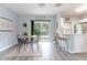 Open dining area with access to kitchen, and sliding doors to a outdoor patio at 1250 Charlesworth Dr, Wesley Chapel, FL 33543