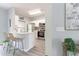 Charming kitchen with white cabinets, stainless steel appliances, and a breakfast bar at 1250 Charlesworth Dr, Wesley Chapel, FL 33543