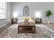 Bright living room features a stylish rug, comfortable seating, and tasteful decorations at 1250 Charlesworth Dr, Wesley Chapel, FL 33543