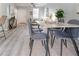 Modern open concept floor plan blends living and dining areas with lots of natural light at 1250 Charlesworth Dr, Wesley Chapel, FL 33543