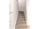 Carpeted stairway leading to the upper level of the home at 1250 Charlesworth Dr, Wesley Chapel, FL 33543