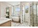 Stunning bathroom featuring a soaking tub, marble accents, and a separate glass-enclosed shower at 13711 Lussier Ln, Spring Hill, FL 34610