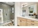 Stylish bathroom featuring a modern vanity, sleek fixtures, and a glass-enclosed shower at 13711 Lussier Ln, Spring Hill, FL 34610