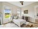 Cozy bedroom with natural light, comfortable furnishings, and a calming view of the outdoors at 13711 Lussier Ln, Spring Hill, FL 34610