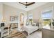 Bright bedroom with a large window, neutral decor, and a convenient workspace for productivity at 13711 Lussier Ln, Spring Hill, FL 34610