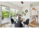 Cozy breakfast nook with a glass table, slider doors to outside, and views of the deck at 13711 Lussier Ln, Spring Hill, FL 34610