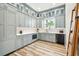 Well-organized butler's pantry featuring stylish cabinetry, countertops, and modern appliances at 13711 Lussier Ln, Spring Hill, FL 34610
