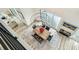 Bright dining room features modern chandelier, wood table, and open floor plan at 13711 Lussier Ln, Spring Hill, FL 34610