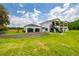 Beautiful two-story home features a detached garage and circular driveway at 13711 Lussier Ln, Spring Hill, FL 34610