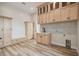 Functional laundry room with ample storage, counter space, and modern design elements at 13711 Lussier Ln, Spring Hill, FL 34610