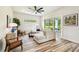 Comfortable living room with contemporary decor, plush sectional sofa, and seamless access to outdoor patio at 13711 Lussier Ln, Spring Hill, FL 34610