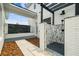 Luxury outdoor shower featuring decorative stone, black hardware, and brick surround at 13711 Lussier Ln, Spring Hill, FL 34610