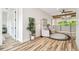 Sitting area with two chairs, decorative plant and beams on the ceiling at 13711 Lussier Ln, Spring Hill, FL 34610