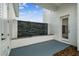 Modern water feature set against a white brick wall and elegant stone at 13711 Lussier Ln, Spring Hill, FL 34610