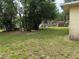 Expansive backyard with mature trees and plenty of space for gardening or recreation at 13742 14Th St, Dade City, FL 33525