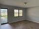 Inviting entryway with storm door, large window, and wood-look vinyl flooring at 13742 14Th St, Dade City, FL 33525