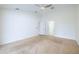 Spacious bedroom with neutral paint offers versatility and connects to an en-suite bath, ensuring comfort and convenience at 1426 Buckner Rd, Valrico, FL 33596