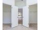 Hallway with mirrored closets and recessed lighting, leading to a room with sliding glass doors at 1426 Buckner Rd, Valrico, FL 33596
