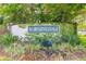 Bloomingdale community entrance sign with brick accents, lush greenery, and beautiful landscaping at 1426 Buckner Rd, Valrico, FL 33596