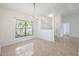 Dining room featuring tile flooring, a large window, and neutral walls at 1426 Buckner Rd, Valrico, FL 33596