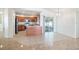 The kitchen features wood cabinets, stainless appliances, and sliding glass doors to the lanai at 1426 Buckner Rd, Valrico, FL 33596