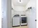 Bright laundry room featuring a modern washer and dryer and plenty of shelf storage at 1426 Buckner Rd, Valrico, FL 33596