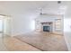 Open living room features a neutral palette, tiled fireplace and large windows that fills the room with natural light at 1426 Buckner Rd, Valrico, FL 33596