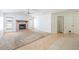 Cozy living room with tiled fireplace, carpet inlay and white walls for a bright, welcoming feel at 1426 Buckner Rd, Valrico, FL 33596