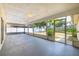 Covered, screened-in porch overlooking the well-maintained backyard, perfect for outdoor living at 1426 Buckner Rd, Valrico, FL 33596