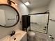 Updated bathroom featuring new vanity, fixtures, and tiled shower at 14446 Reuter Strasse Cir # 3, Tampa, FL 33613