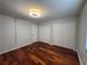 Spacious bedroom features gleaming wood floors and ample closet space at 14446 Reuter Strasse Cir # 3, Tampa, FL 33613