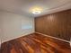Stylish bedroom featuring wood floors and an accent wall at 14446 Reuter Strasse Cir # 3, Tampa, FL 33613