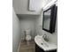 Clean half bath with modern vanity, mirror and lighting at 14446 Reuter Strasse Cir # 3, Tampa, FL 33613