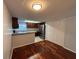 Open kitchen featuring stainless steel appliances, granite counters, and dark-toned wood cabinets at 14446 Reuter Strasse Cir # 3, Tampa, FL 33613
