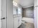 Well-lit bathroom features modern finishes, tiled shower and flooring, and a vanity with great storage at 16511 66Th E Ln, Parrish, FL 34219