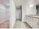 Modern bathroom with granite countertops, double sinks, and a spacious walk-in closet at 16511 66Th E Ln, Parrish, FL 34219